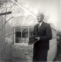 Ed Butler outside greenhouse